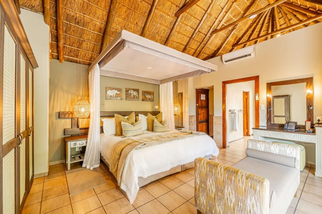 Luxury lodge room in Africa featuring high-quality finishes, African-inspired decor, and elegant furnishings