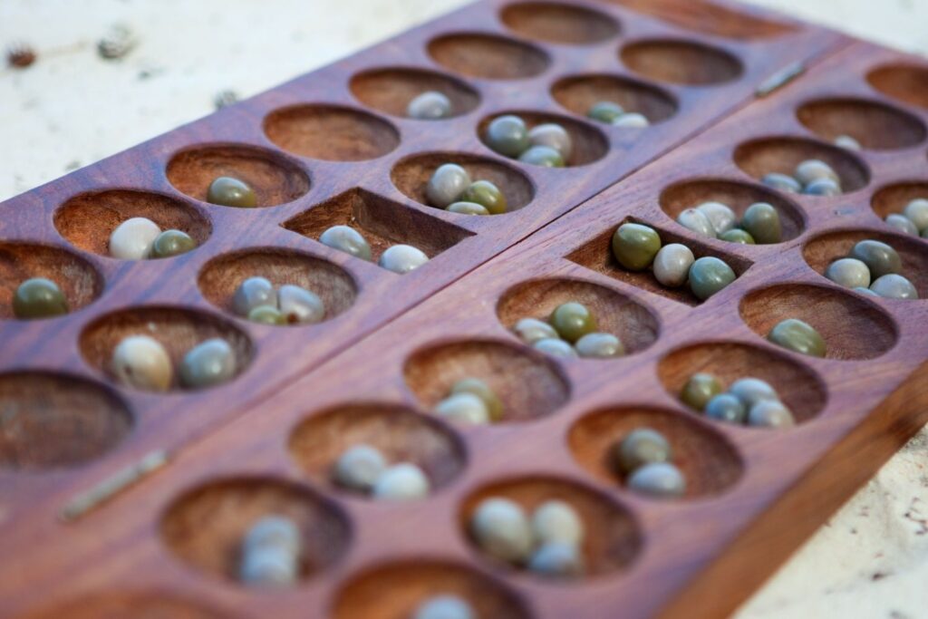 Traditional African game boards and vibrant street culture experienced during day tours
