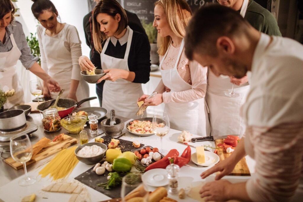 Participants enjoying a hands-on cooking class featuring traditional South African cuisine.