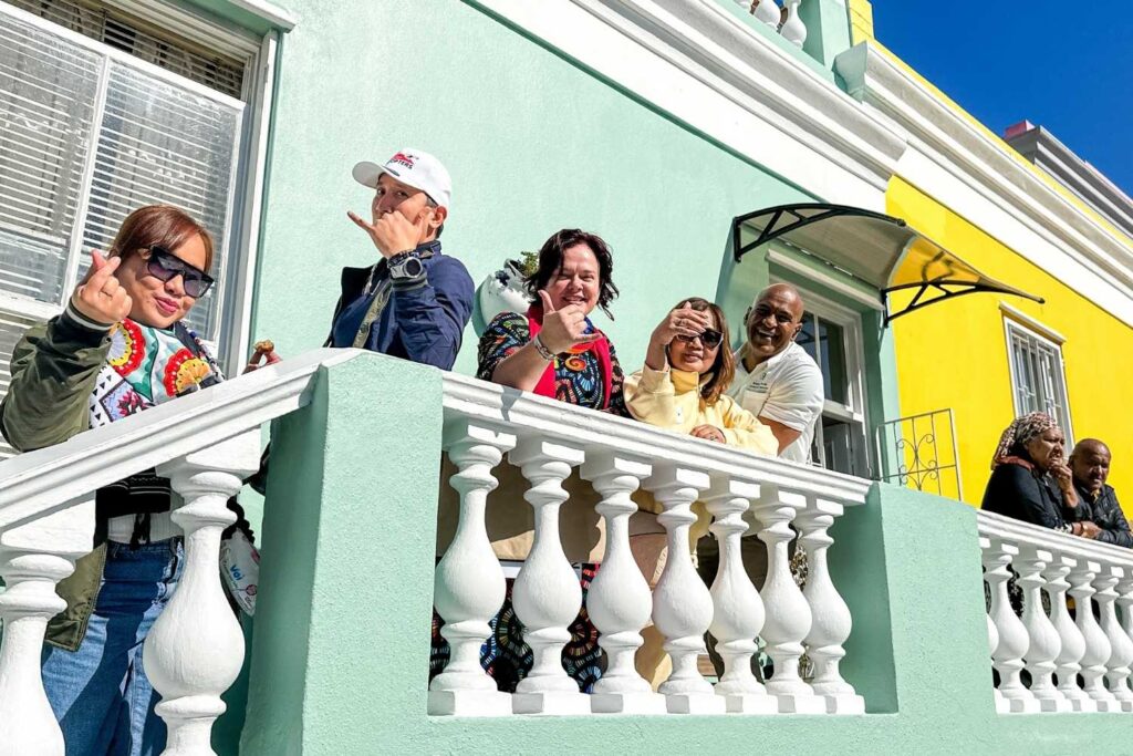 Incentive group exploring the colorful streets and rich culture of Bo-Kaap in Cape Town, South Africa