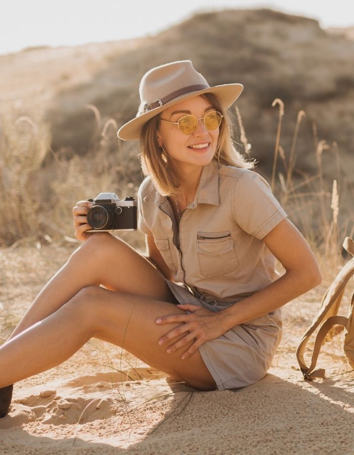 Various travelers enjoying different African experiences – from safari adventures to cultural tours and beach escapes