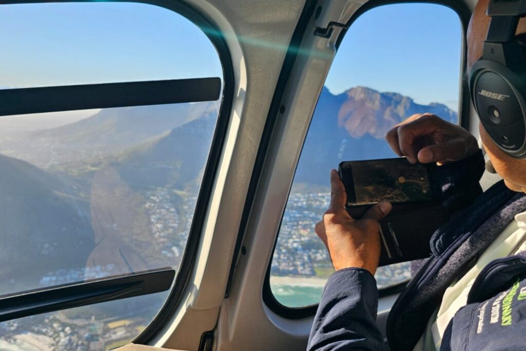 Aerial view of Cape Town’s coastline and Table Mountain from a helicopter during one of our exciting tours.