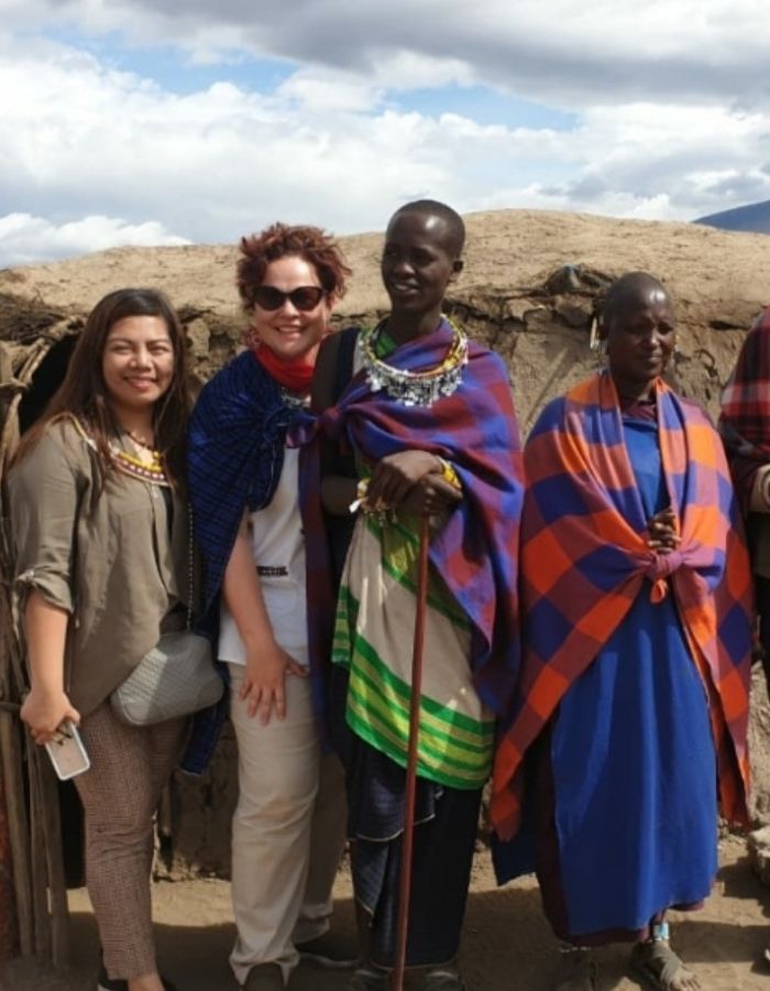 Visitors immersed in the vibrant culture and traditions of the Maasai community in Tanzania.